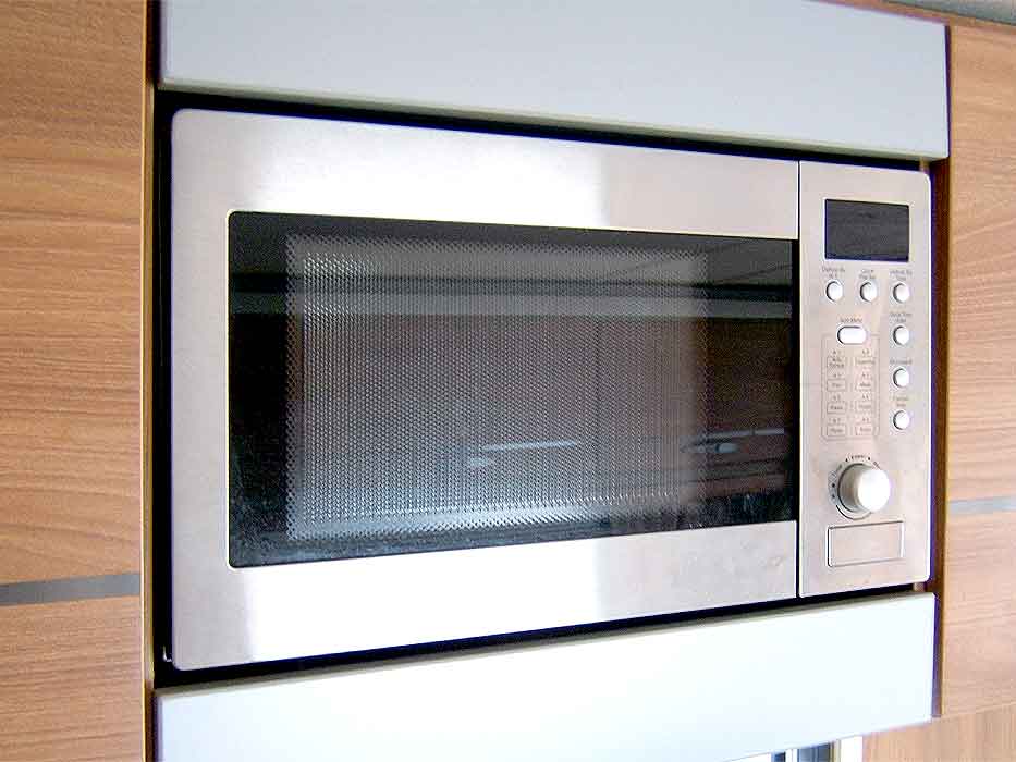The stainless steel microwave provides additional heating and cooking options.